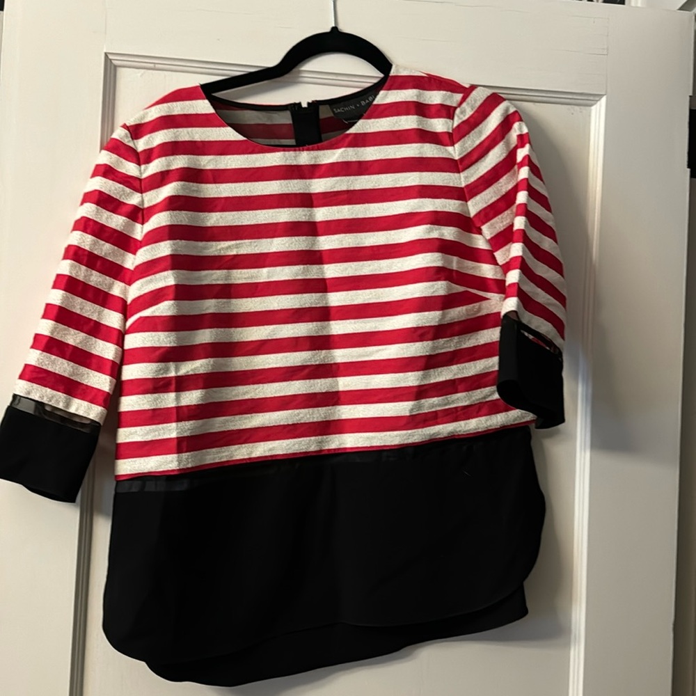 Red and white striped top with black cuffs and shirt tail